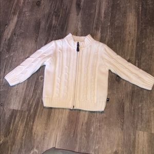 White infant sweater